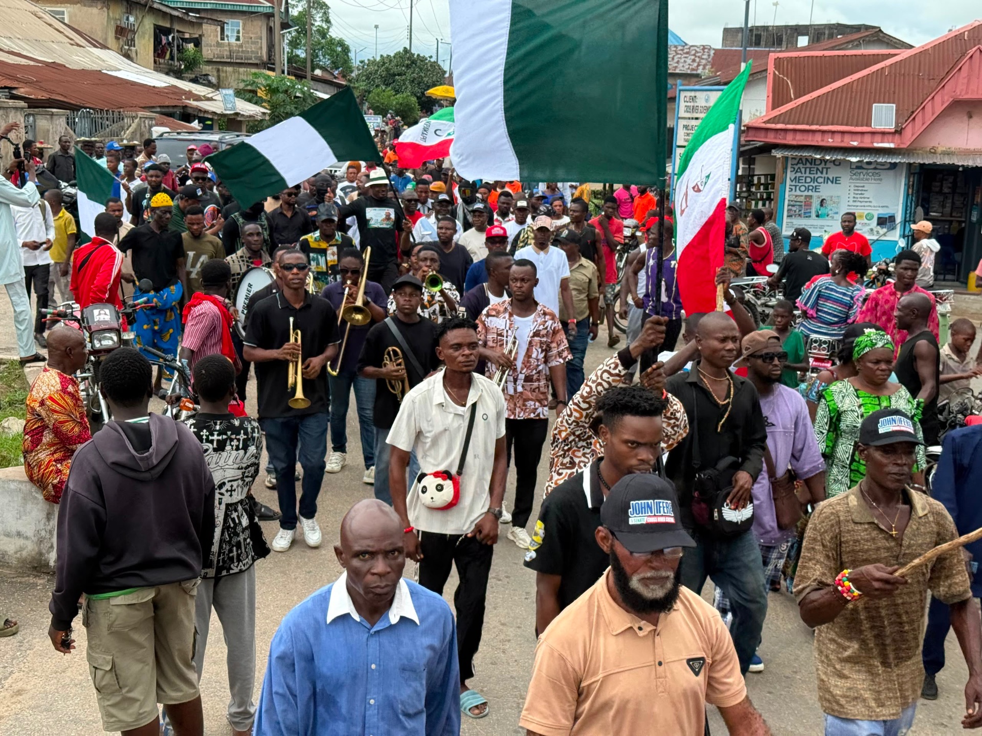 PDP supporters marching with Nigerian and party flags